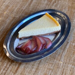 Cheesecake con peras al vino